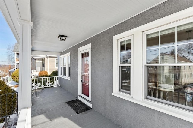 property entrance featuring a porch