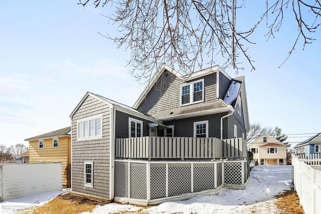 snow covered house with covered porch