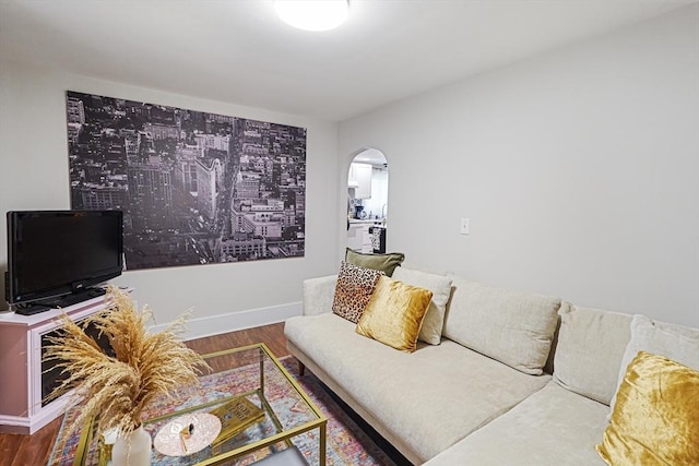 22 Tampa St, Worcester, MA 01604 - living room featuring wood finished floors, arched walkways, and baseboards
