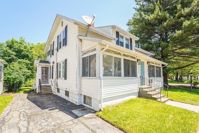 22 Tampa St, Worcester, MA 01604 - view of home's exterior featuring entry steps, a lawn, and a chimney