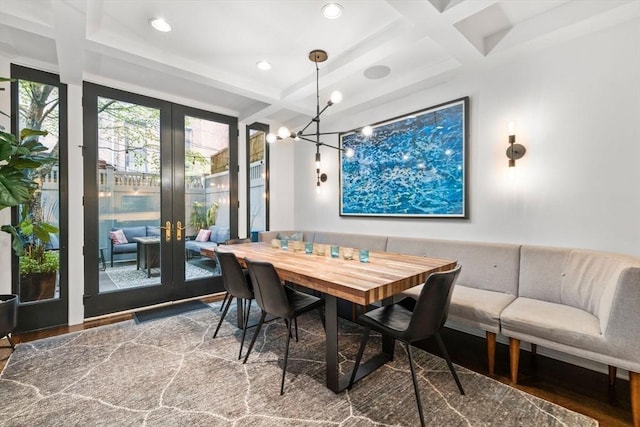 9 Bond St, Boston, MA 02118 - dining space featuring coffered ceiling, french doors, wood finished floors, beam ceiling, and a chandelier