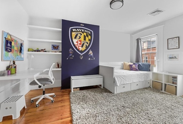 9 Bond St, Boston, MA 02118 - bedroom featuring wood finished floors and an office area