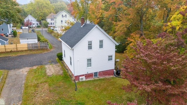 view of home's exterior with a yard