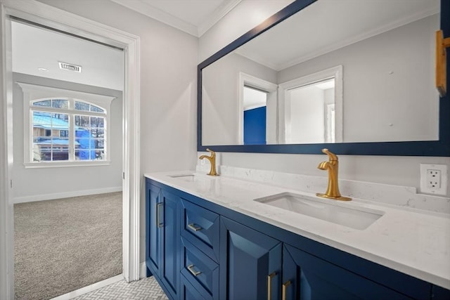 bathroom with ornamental molding and vanity