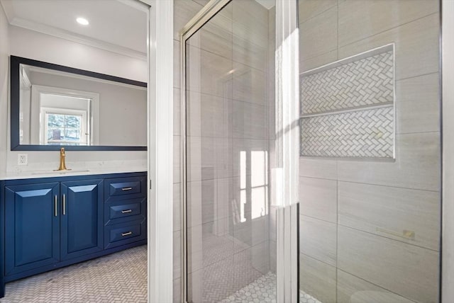 bathroom featuring ornamental molding, vanity, and walk in shower