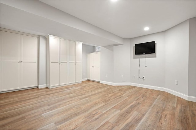 basement featuring light wood-type flooring