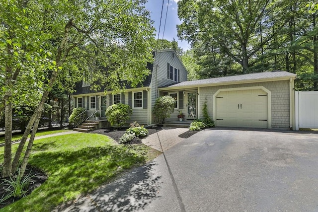 1 Columbine Rd, Milton, MA 02186 - view of front facade with driveway and a garage
