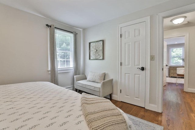 1 Columbine Rd, Milton, MA 02186 - bedroom featuring dark wood-type flooring, baseboards, and a baseboard radiator
