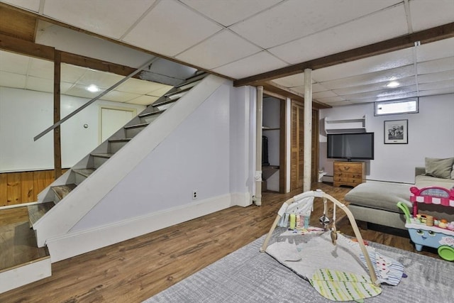 1 Columbine Rd, Milton, MA 02186 - living room with wood finished floors, stairway, and a drop ceiling