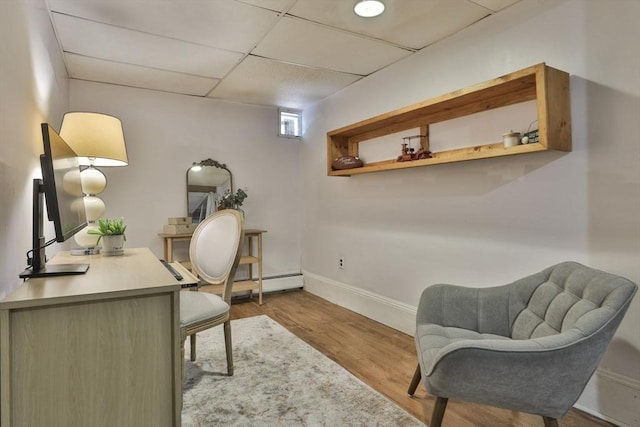 1 Columbine Rd, Milton, MA 02186 - office with wood finished floors, baseboards, and a baseboard heating unit