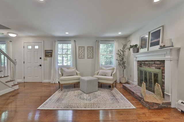 1 Columbine Rd, Milton, MA 02186 - living area with stairs, recessed lighting, baseboards, a fireplace, and wood finished floors