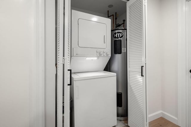 10 Rogers Unit 1119, Cambridge, MA 02142 - washroom featuring stacked washer and clothes dryer and electric water heater