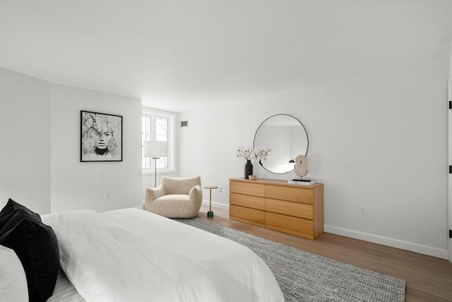 10 Rogers Unit 1119, Cambridge, MA 02142 - bedroom featuring wood finished floors and baseboards