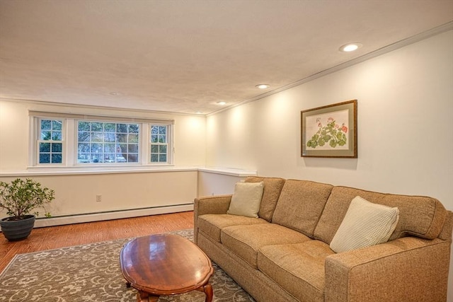 living room with recessed lighting, a baseboard radiator, wood finished floors, and crown molding