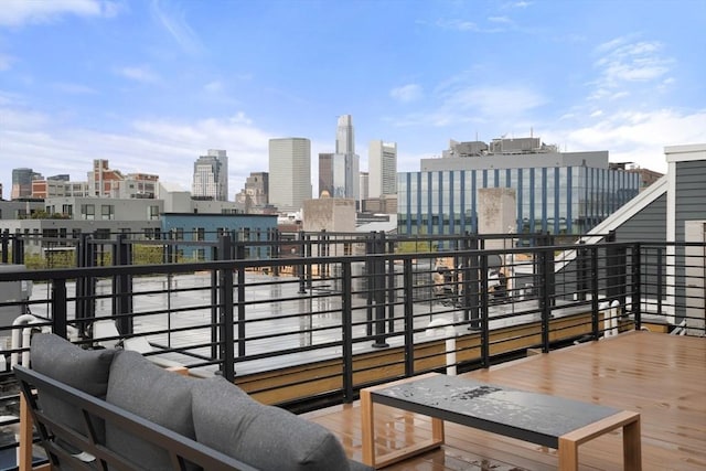 wooden deck with a view of skyline