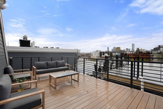 deck featuring an outdoor living space and a view of city