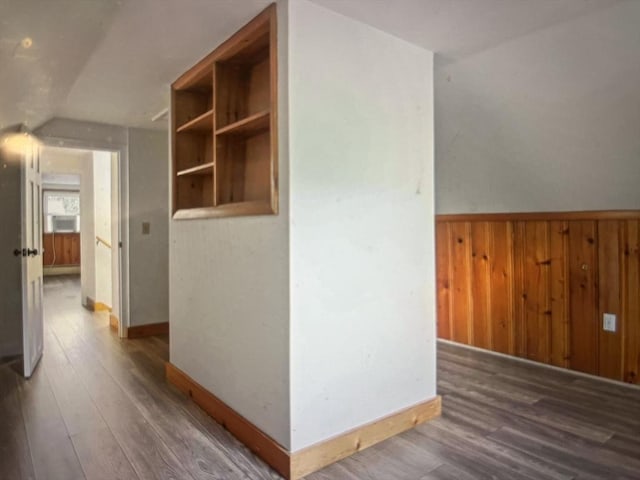 35 Marsh Ave, Worcester, MA 01605 - hallway featuring wood finished floors, wood walls, baseboards, wainscoting, and lofted ceiling
