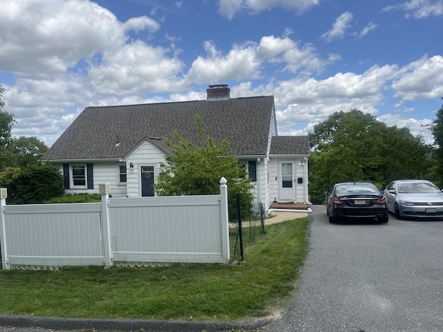 35 Marsh Ave, Worcester, MA 01605 - view of front facade with a chimney and roof with shingles