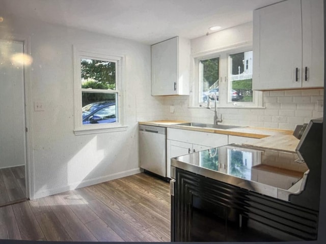 35 Marsh Ave, Worcester, MA 01605 - kitchen with stainless steel dishwasher, a sink, baseboards, and backsplash