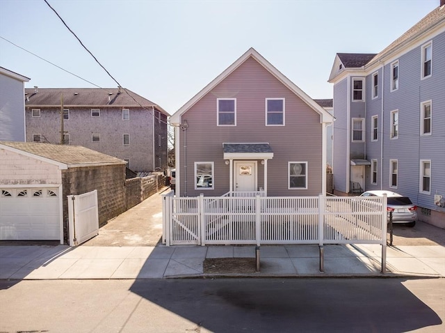 view of front facade featuring a fenced front yard and a gate