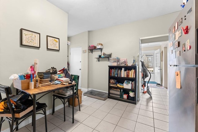 office area with baseboards and light tile patterned floors