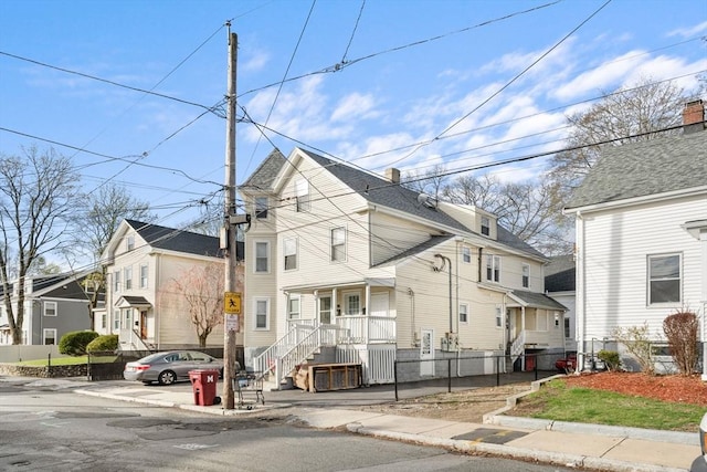 view of front of property with a residential view and covered porch
