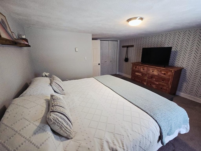bedroom with wallpapered walls and baseboards