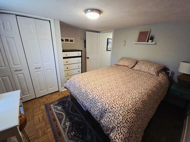 bedroom featuring a closet and a textured ceiling