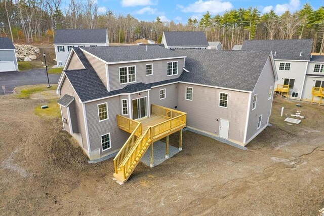 back of house with a wooden deck, stairs, and a shingled roof