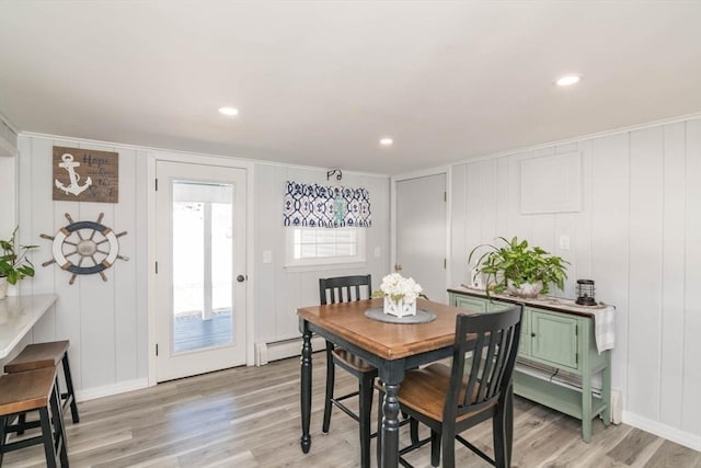 dining room with recessed lighting, light wood-style flooring, and baseboard heating