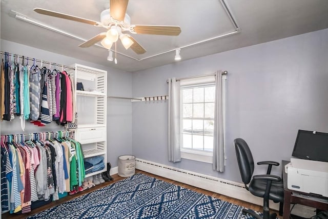 interior space with ceiling fan and wood finished floors