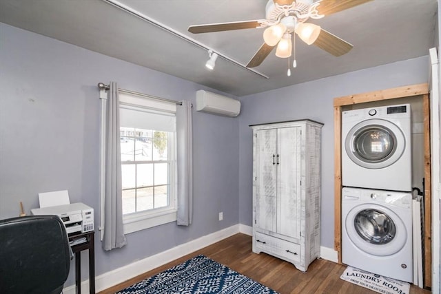 laundry area with laundry area, baseboards, stacked washer / dryer, dark wood-style floors, and a wall mounted AC