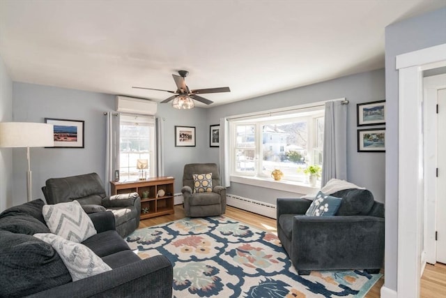 living area featuring a baseboard radiator, a baseboard heating unit, light wood-style floors, an AC wall unit, and a ceiling fan