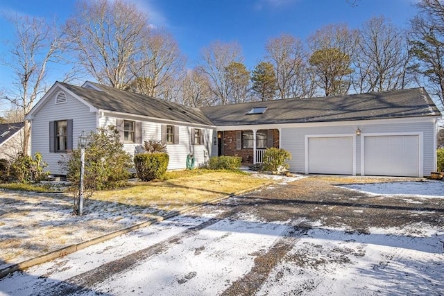 ranch-style home featuring a garage