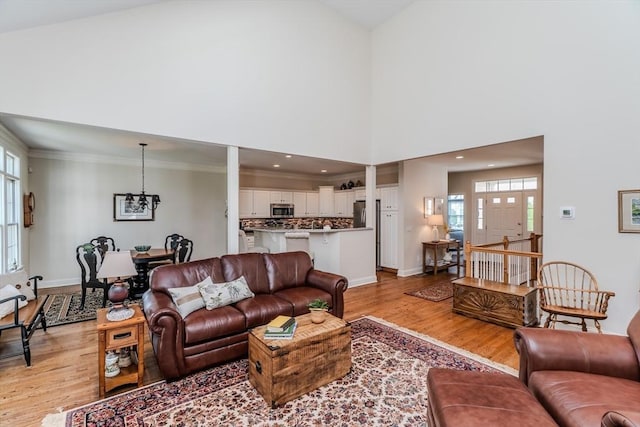 124 High Pine Cir Unit 124, Wilbraham, MA 01095 - living area featuring light wood-style floors, a chandelier, crown molding, and recessed lighting