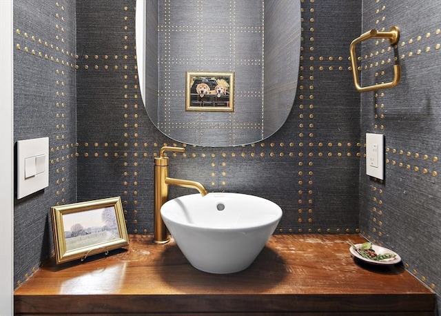 bathroom with a sink and wood finished floors