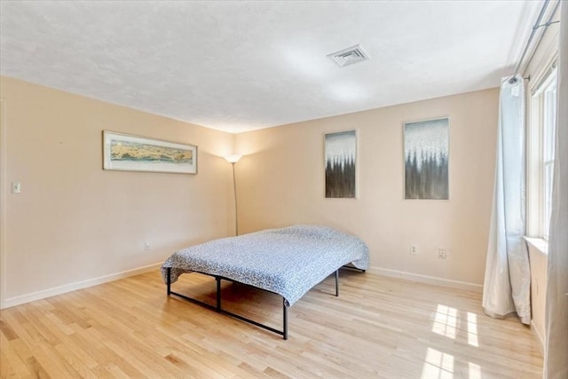 35 Merrymount Rd Unit 12, Quincy, MA 02169 - bedroom with baseboards and light wood-style flooring