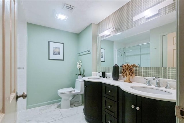 35 Merrymount Rd Unit 12, Quincy, MA 02169 - bathroom with a shower stall, double vanity, toilet, and baseboards