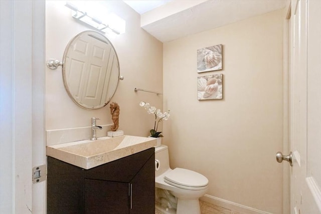 35 Merrymount Rd Unit 12, Quincy, MA 02169 - half bath featuring toilet, vanity, and baseboards