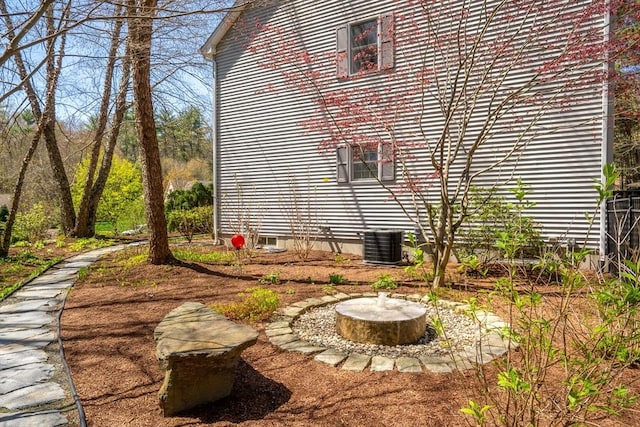 view of property exterior with central AC