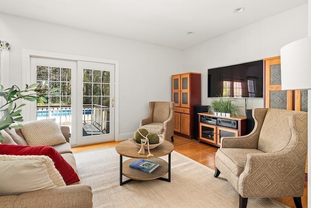 sitting room with light wood-style flooring