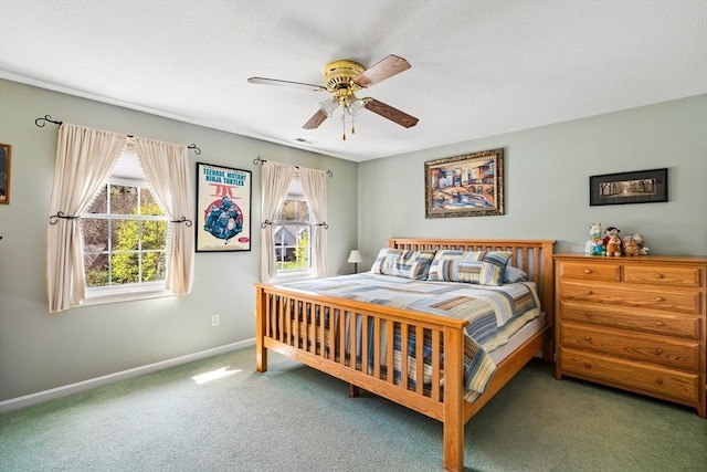 bedroom featuring carpet floors, baseboards, visible vents, and ceiling fan