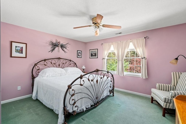 bedroom with baseboards, a ceiling fan, carpet flooring, and visible vents