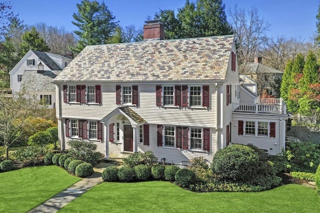 15 Alden Rd, Wellesley, MA 02481 - colonial-style house featuring a chimney and a front lawn