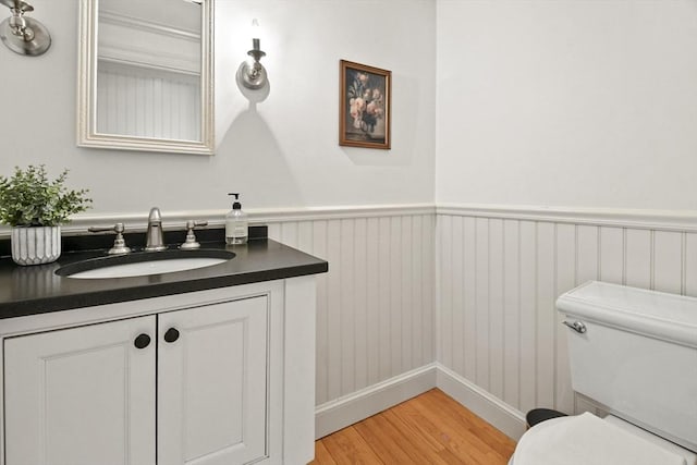 15 Alden Rd, Wellesley, MA 02481 - bathroom featuring wood finished floors, vanity, toilet, and a wainscoted wall
