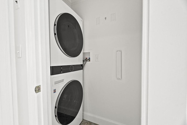 15 Alden Rd, Wellesley, MA 02481 - laundry area with stacked washer / dryer and baseboards