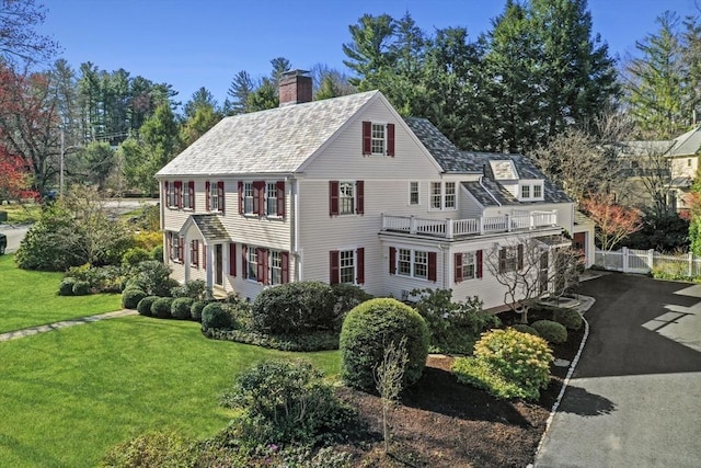 15 Alden Rd, Wellesley, MA 02481 - view of front of property featuring a chimney and asphalt driveway