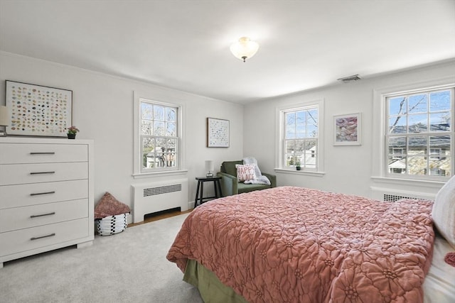 15 Alden Rd, Wellesley, MA 02481 - carpeted bedroom with radiator heating unit, multiple windows, and ornamental molding