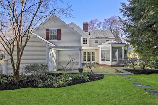 15 Alden Rd, Wellesley, MA 02481 - rear view of property featuring a patio area, a chimney, a sunroom, and a yard