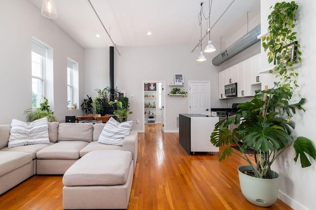 960 Broadway Unit 10, Chelsea, MA 02150 - living room with light wood finished floors and recessed lighting